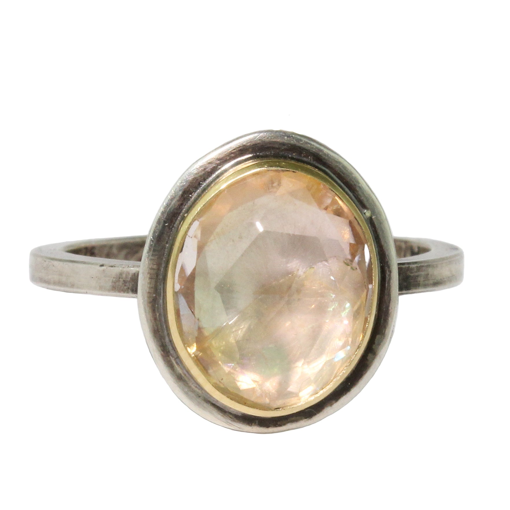 Silver ring with gemstone on a white background
