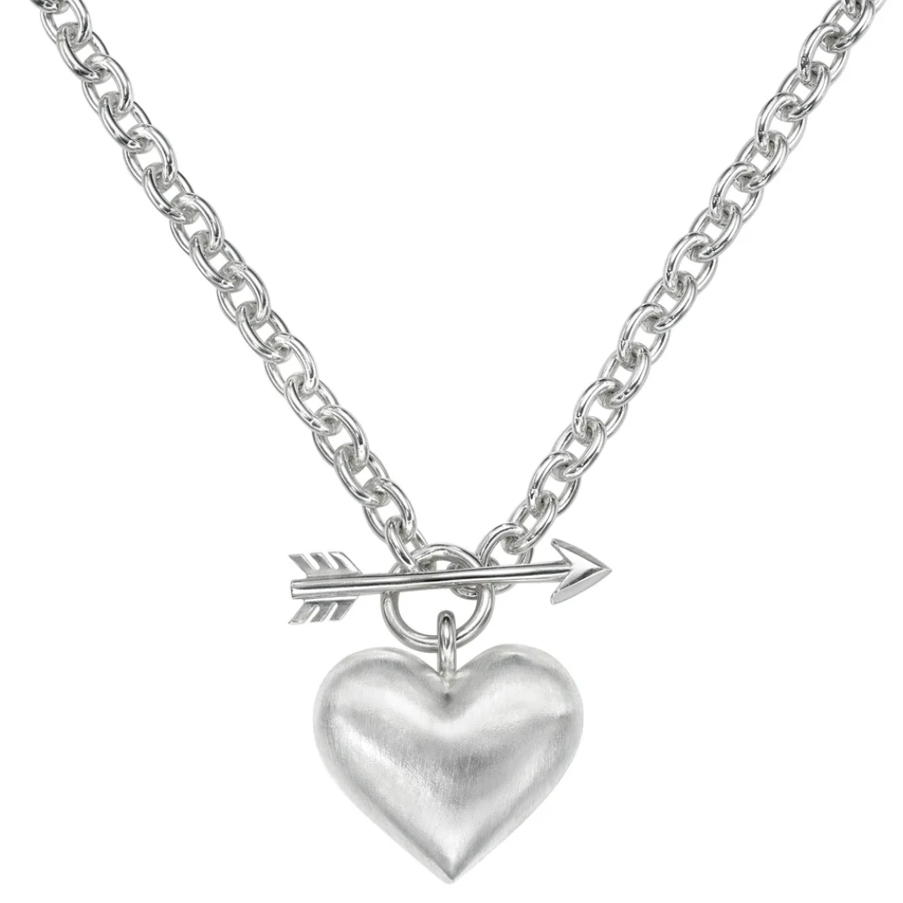 Silver necklace with a heart pendant and arrow charm on a white background