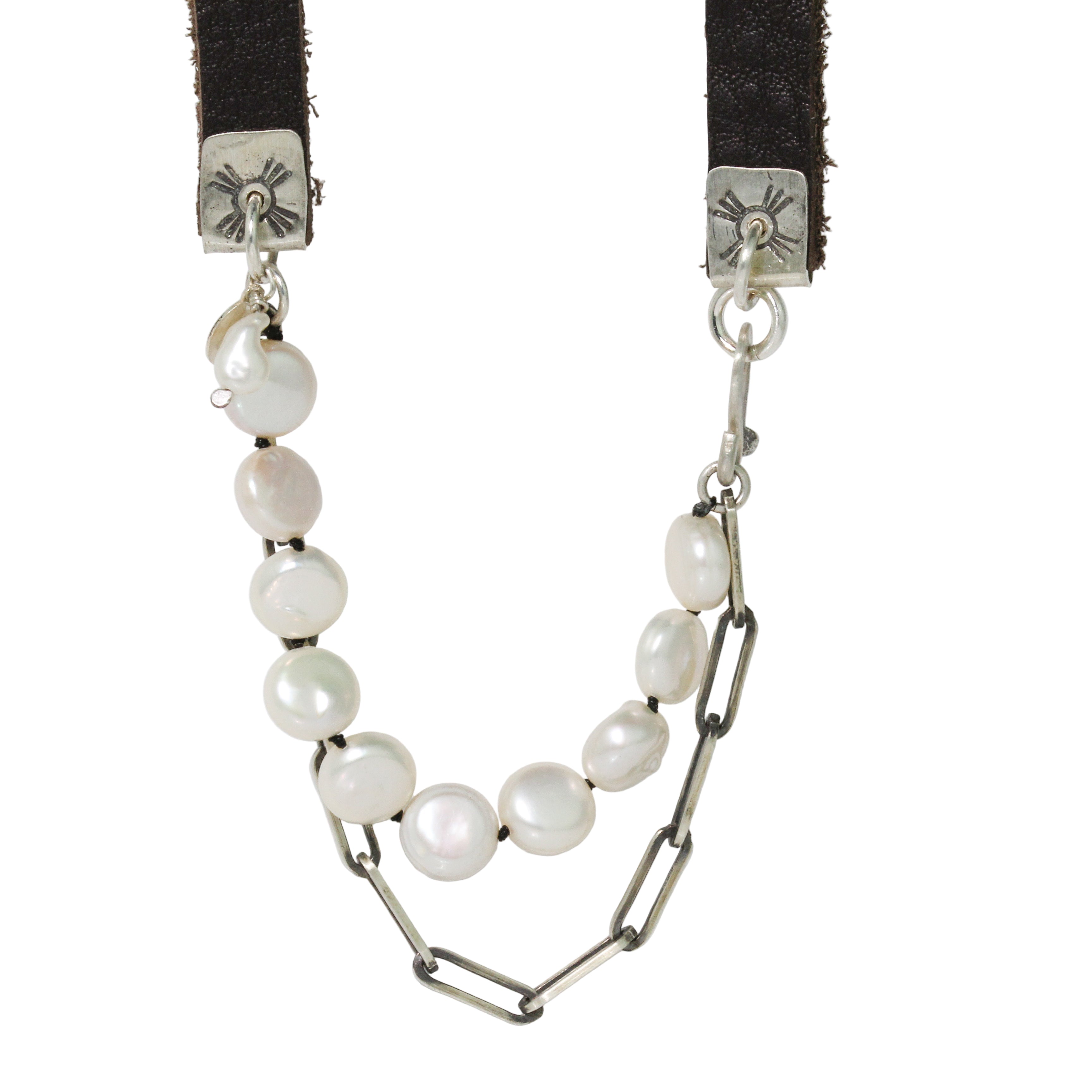Necklace with pearls and silver metalwork on a white background