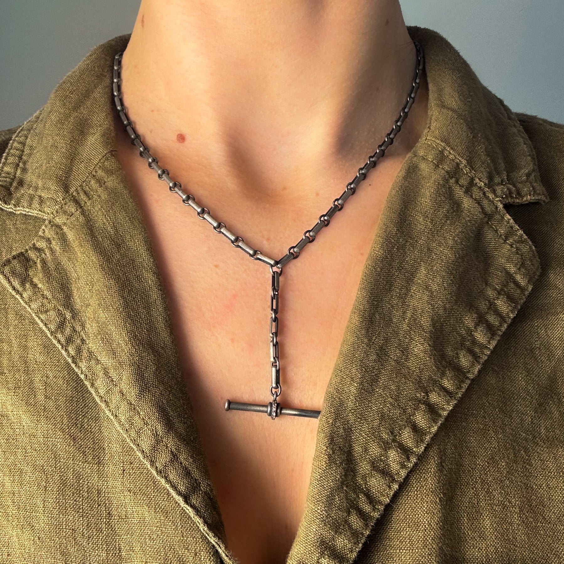 Diamond T necklace by Manuk on model